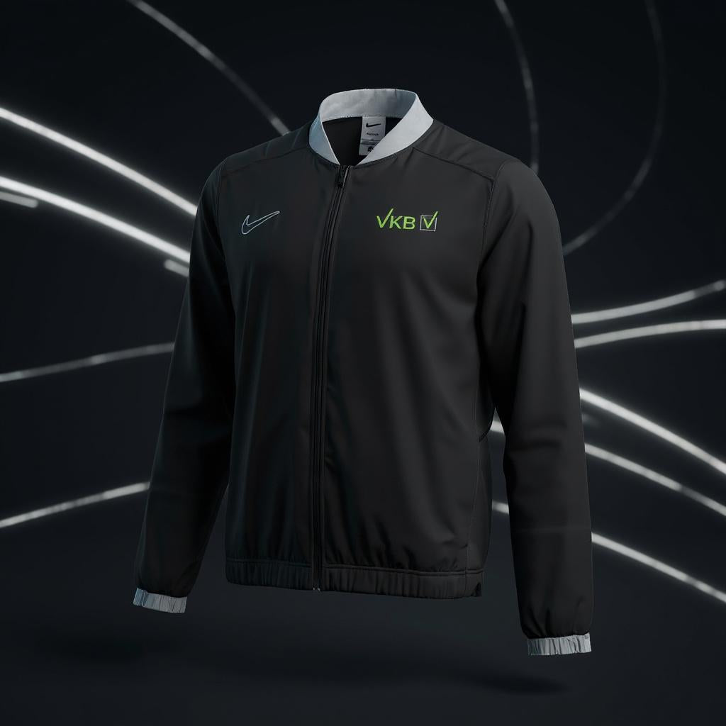 „Nike Academy 25 Dri-FIT Woven Track Jacke in Schwarz mit grauen Details an Kragen und Bündchen, VKB-Logo und Nike-Swoosh auf der Brust, durchgehender Reißverschluss.“
